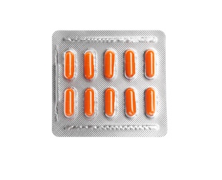 Pills in blister pack on white background, top view