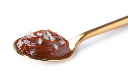 Photo of Salted caramel in spoon isolated on white