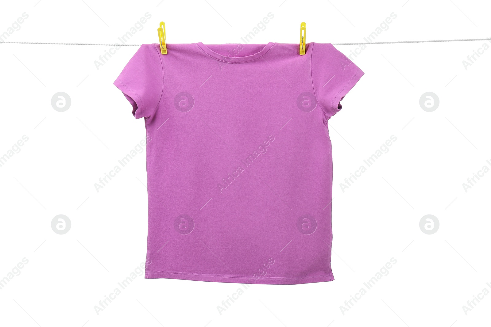 Photo of One violet t-shirt drying on washing line isolated on white