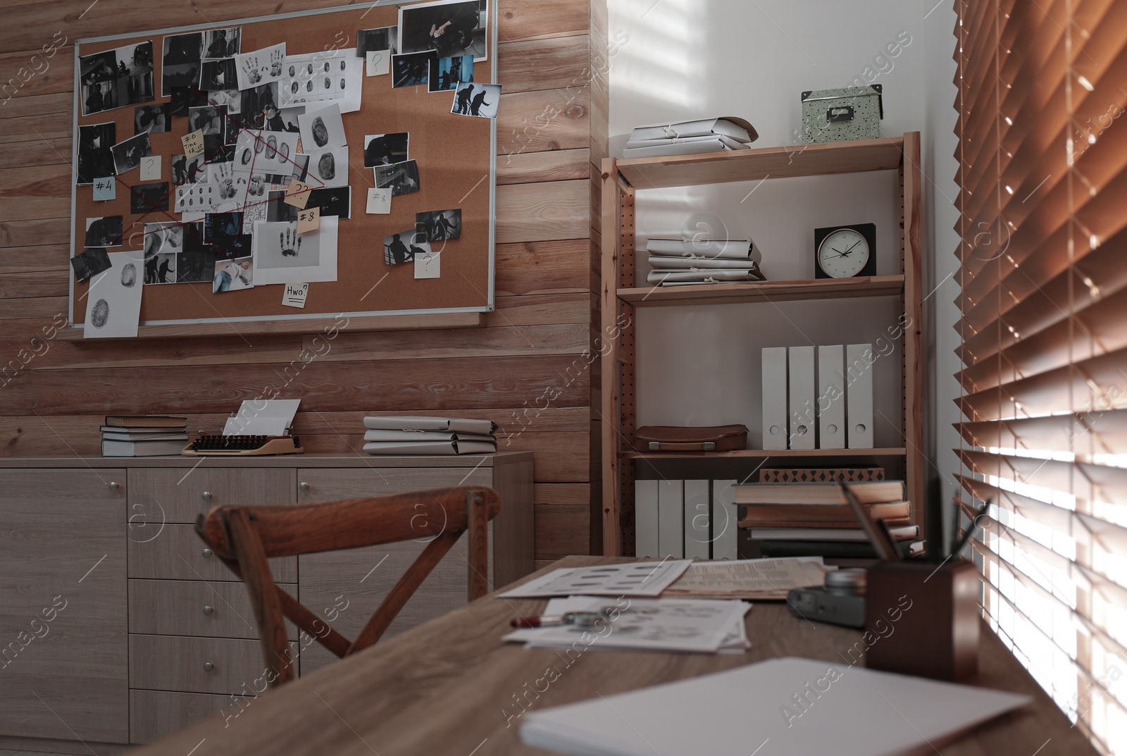 Photo of Wooden desk near window in detective's office