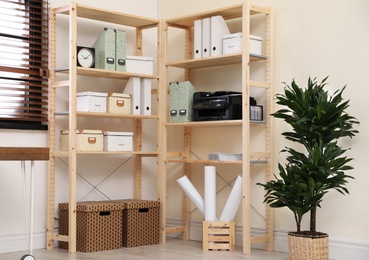 Photo of Modern home workplace with wooden storage. Idea for interior design