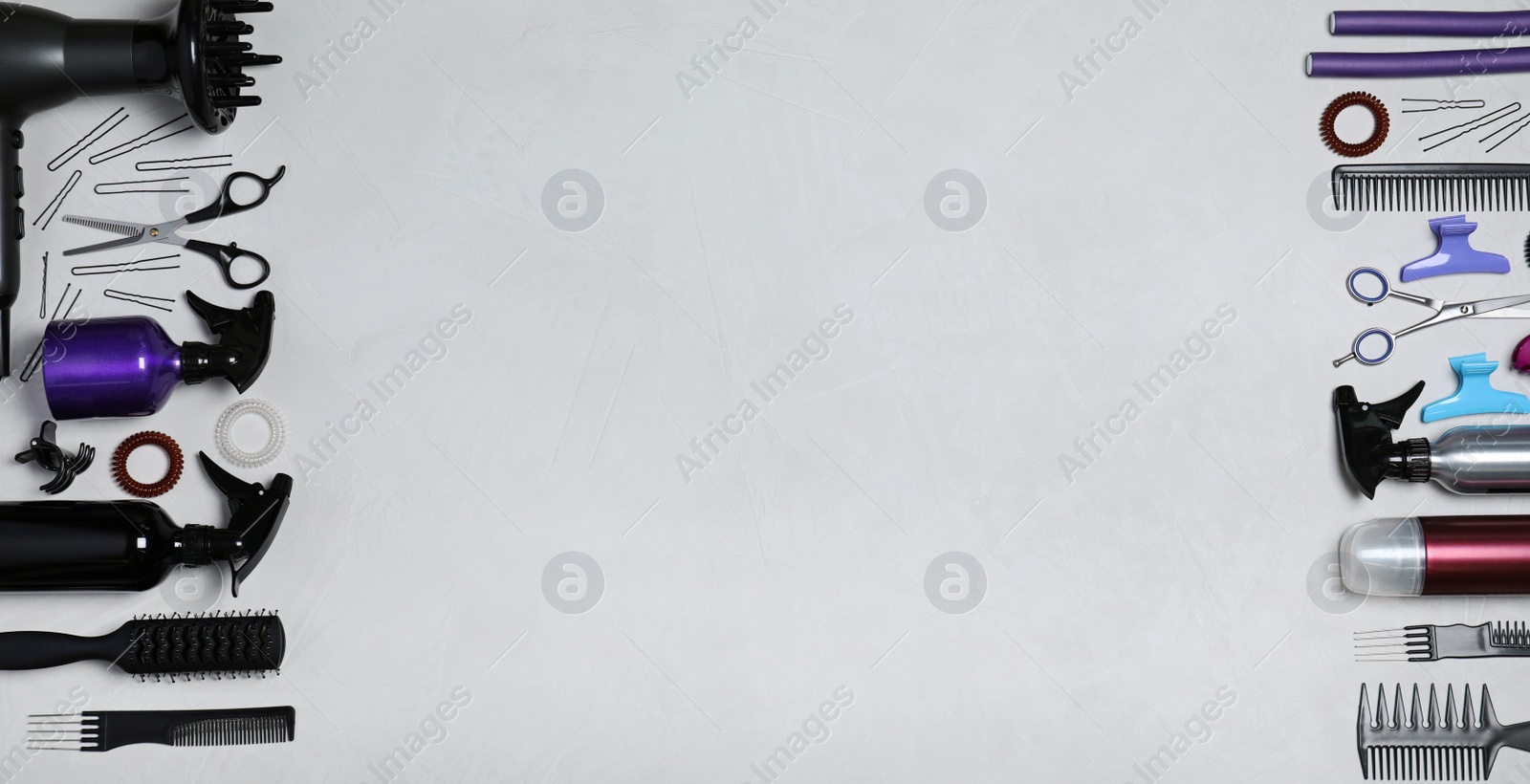 Photo of Set of professional hairdresser's tools on light background, flat lay. Space for text