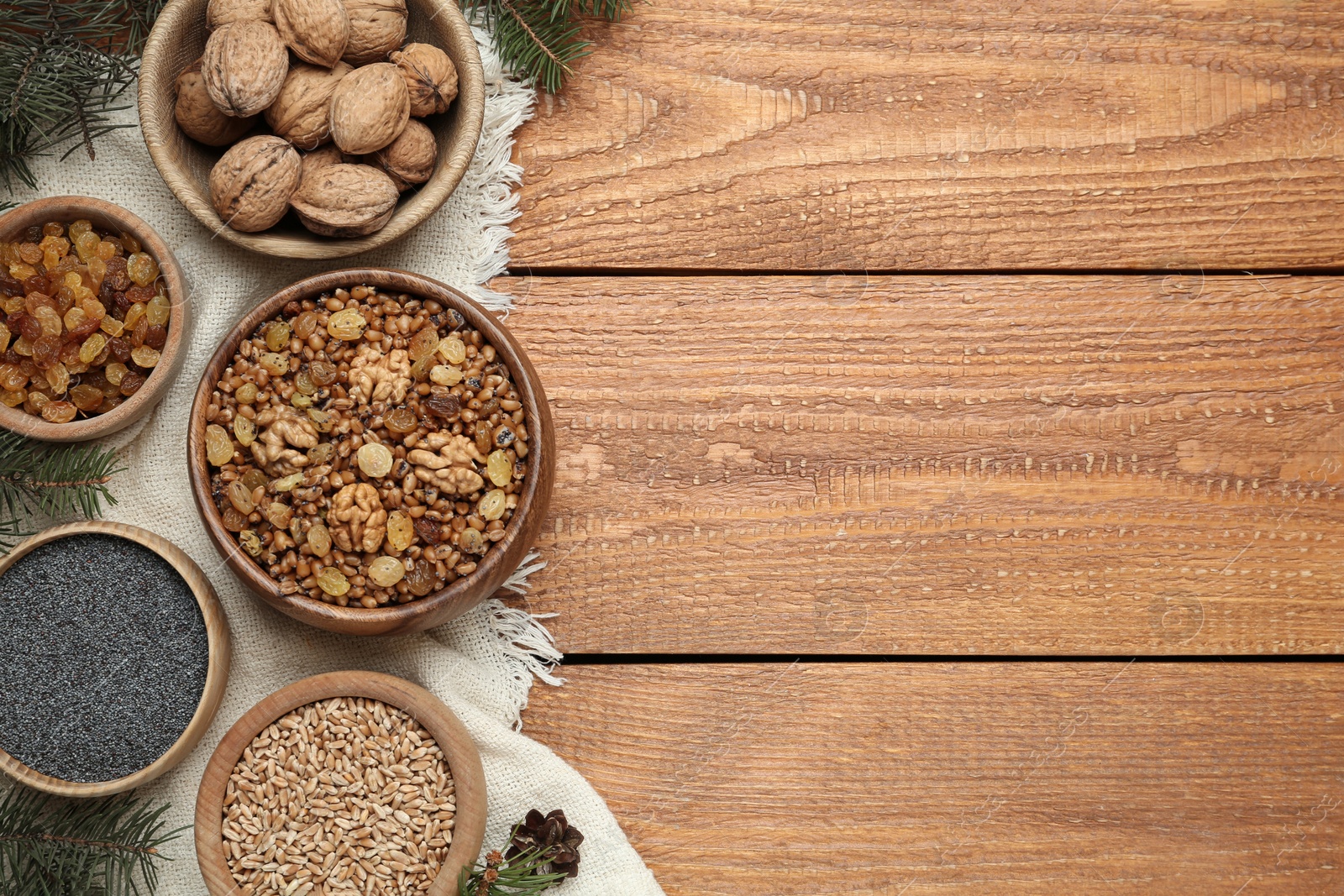 Photo of Traditional Christmas slavic dish kutia served on wooden table, flat lay. Space for text