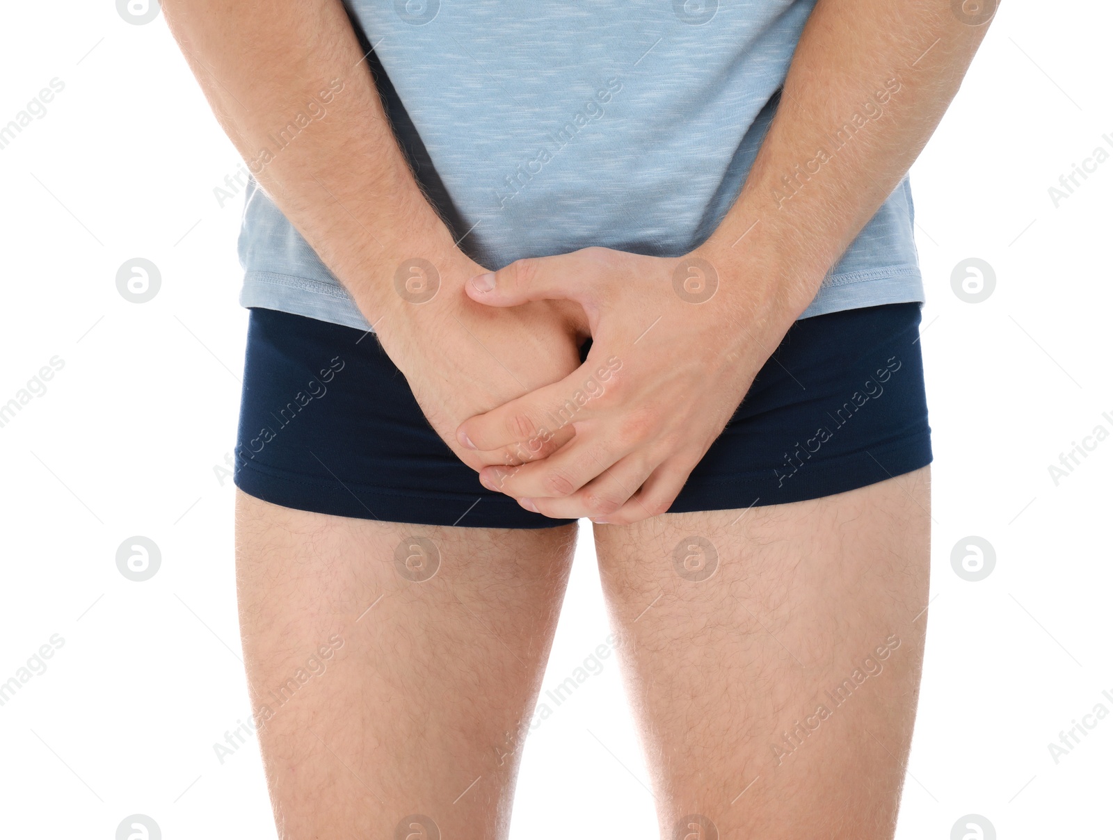 Photo of Man suffering from pain on white background, closeup. Urology problems