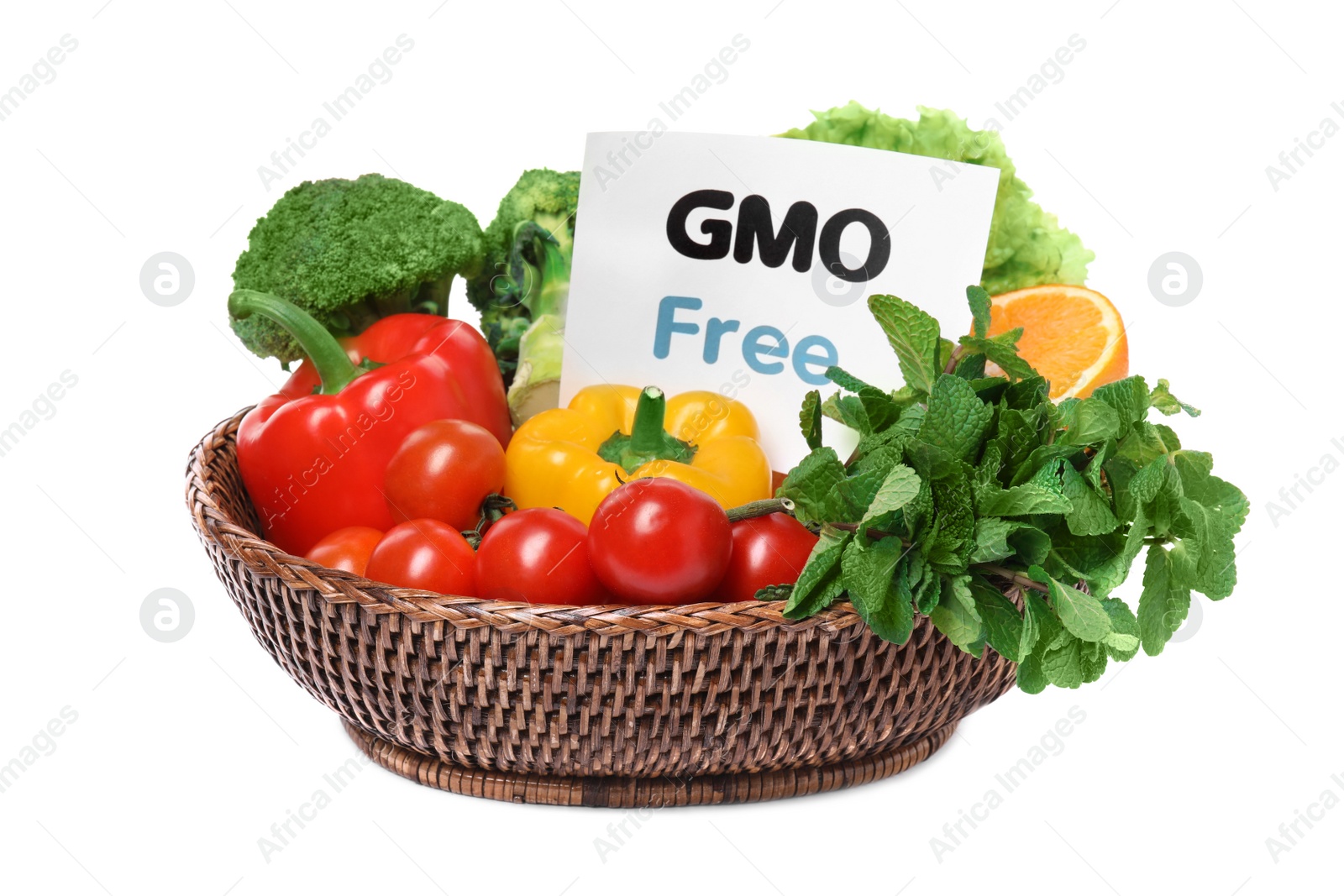 Photo of Tasty fresh GMO free products and paper card on white background