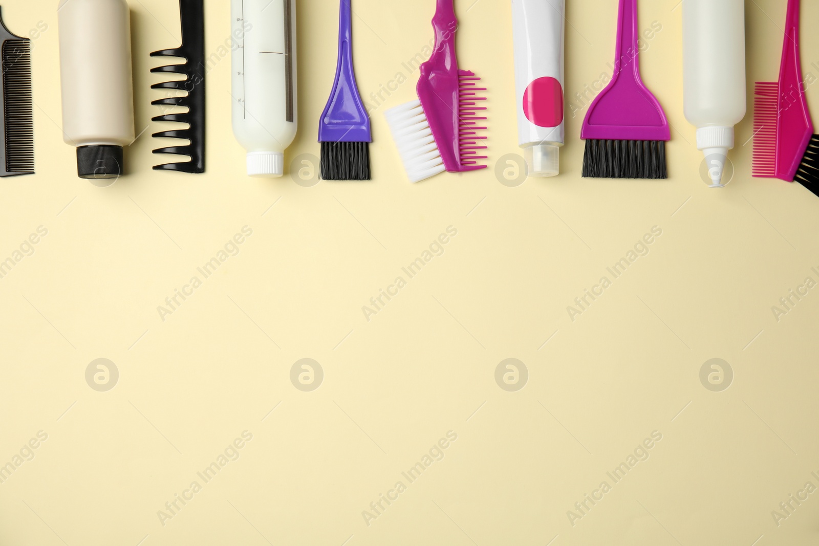 Photo of Professional tools for hair dyeing on light background, flat lay. Space for text