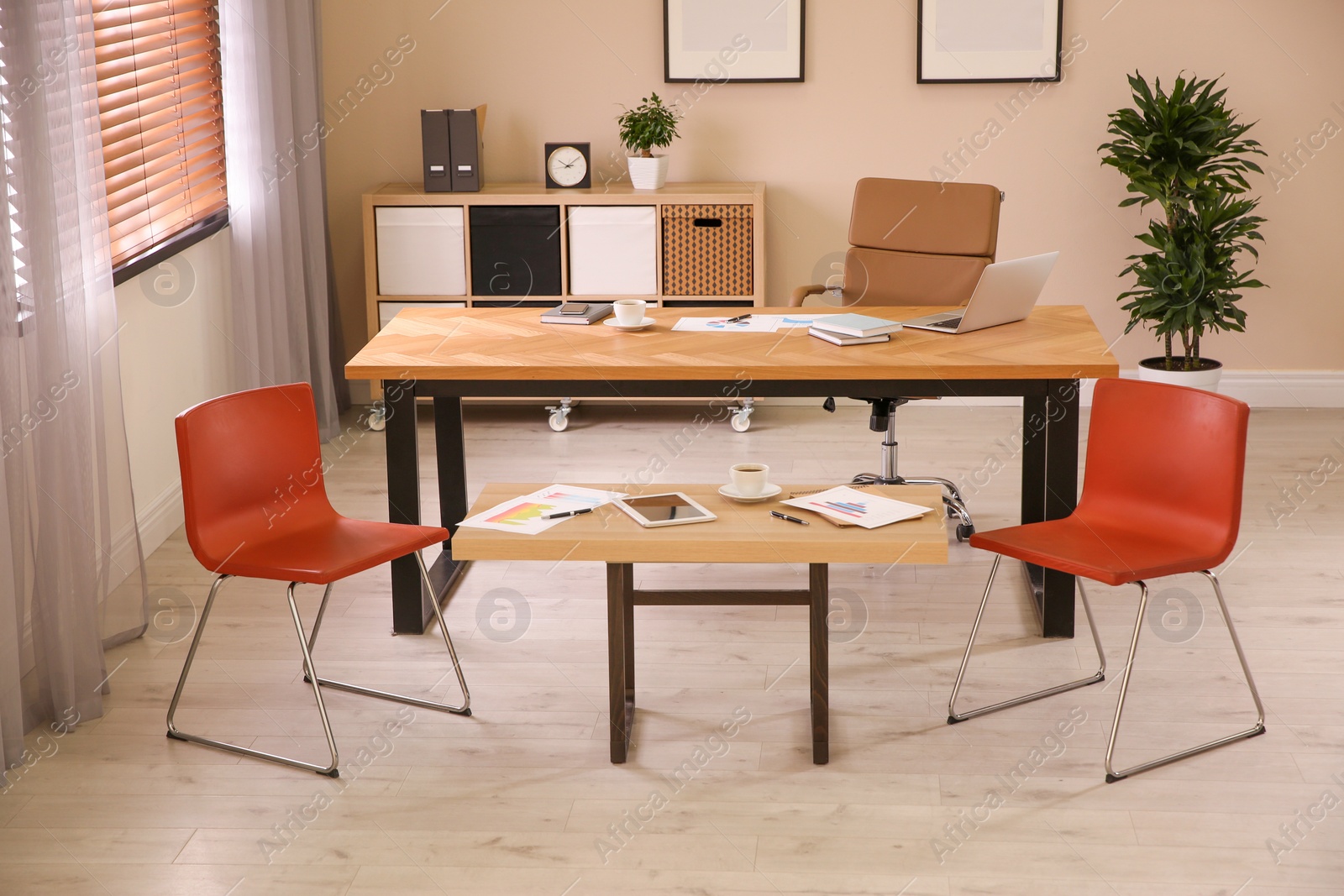 Photo of Director's office with large wooden table. Interior design