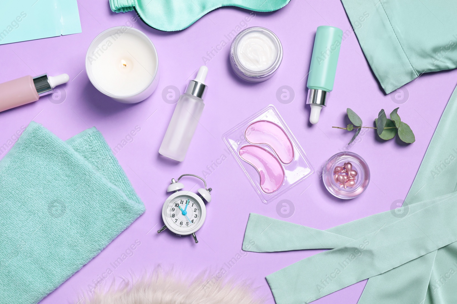 Photo of Flat lay composition with sleeping mask and skin care products on violet background