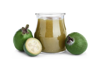 Feijoa jam in glass jar and fruits on white background