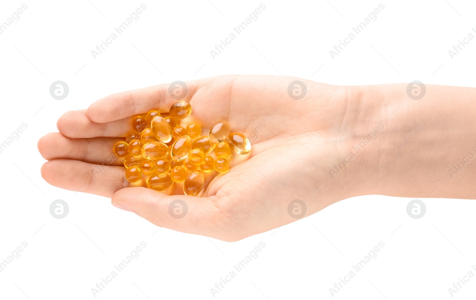 Photo of Woman holding color pills on white background, closeup