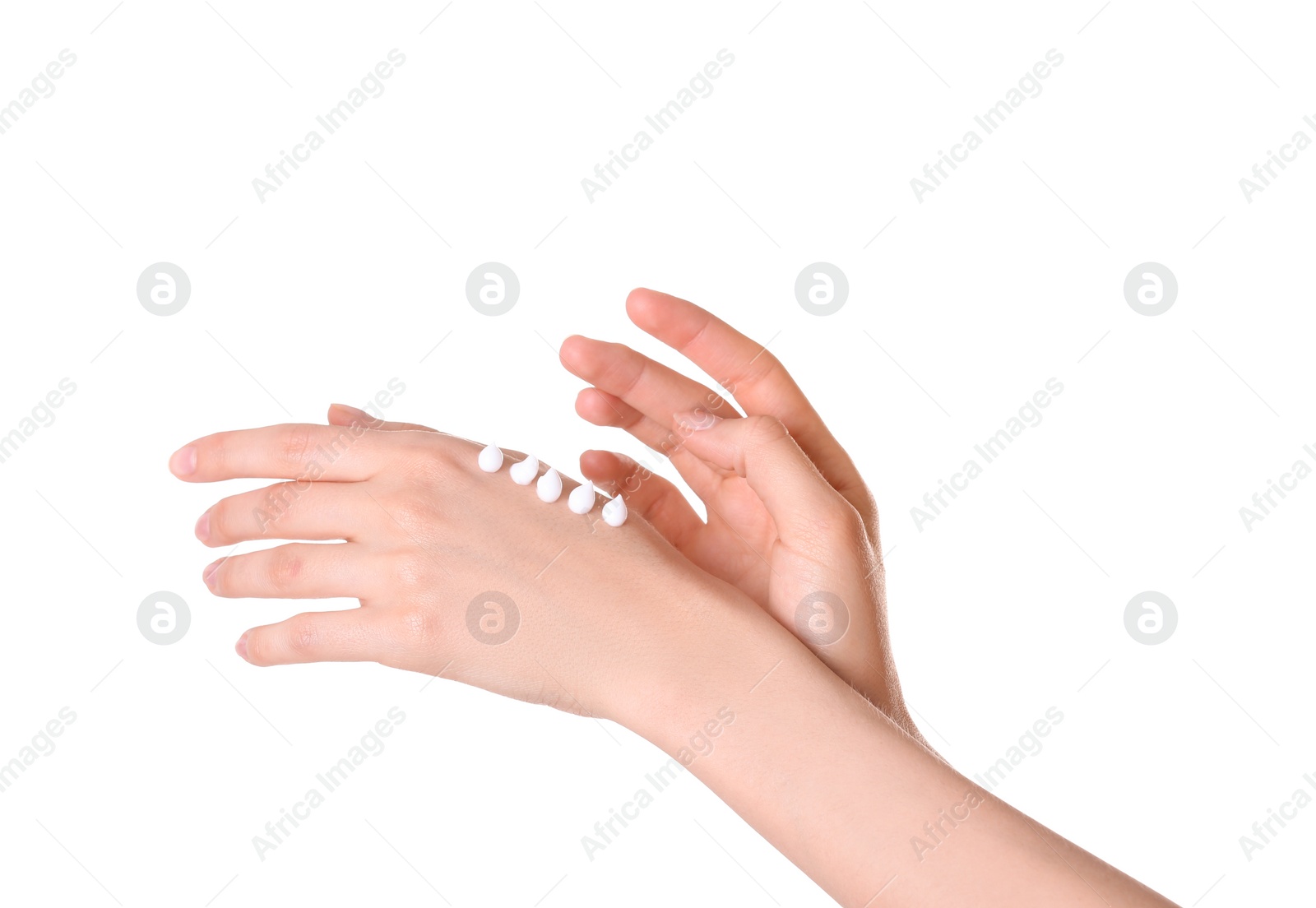 Photo of Young woman applying cream onto her hands on white background, closeup