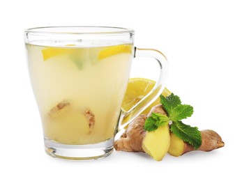 Glass cup with delicious ginger tea, lemon and mint on white background