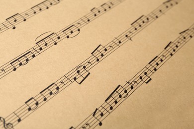 Photo of Paper sheet with musical notes, closeup view