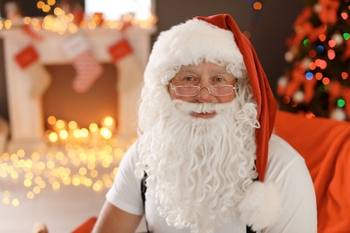 Authentic Santa Claus with bushy beard indoors