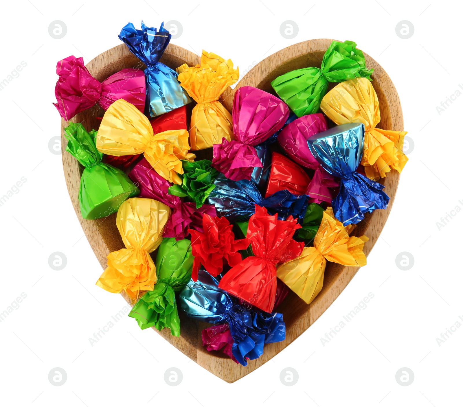 Photo of Heart shaped plate with candies in colorful wrappers isolated on white, top view