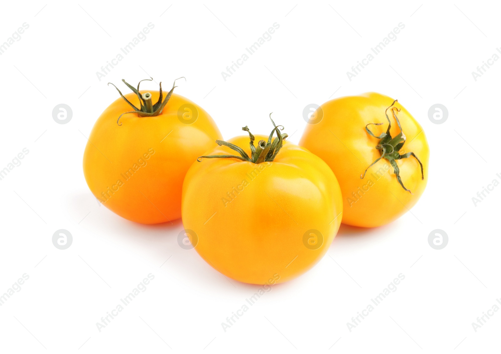 Photo of Fresh ripe yellow tomatoes on white background