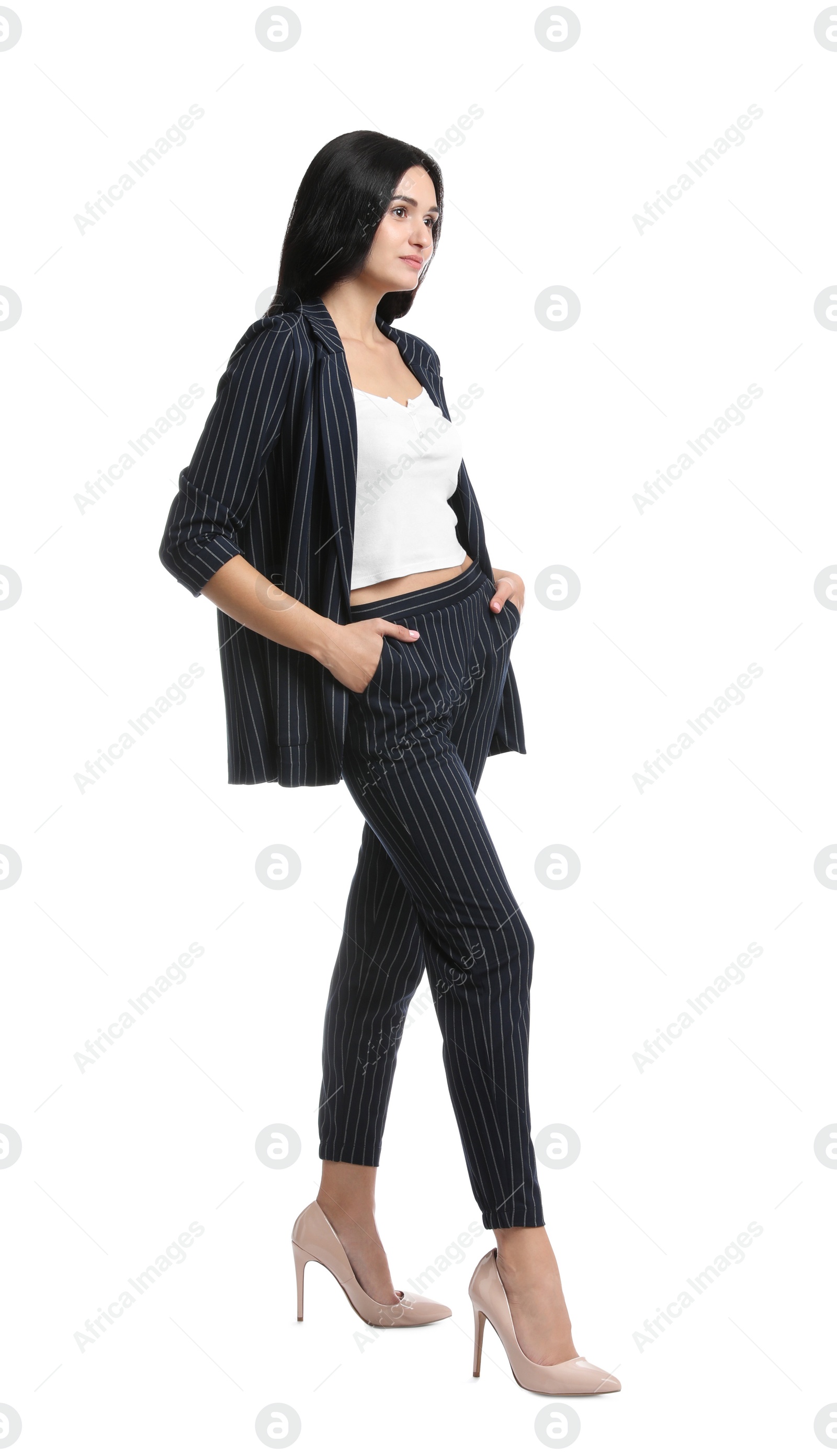 Photo of Full length portrait of beautiful woman in formal suit on white background. Business attire