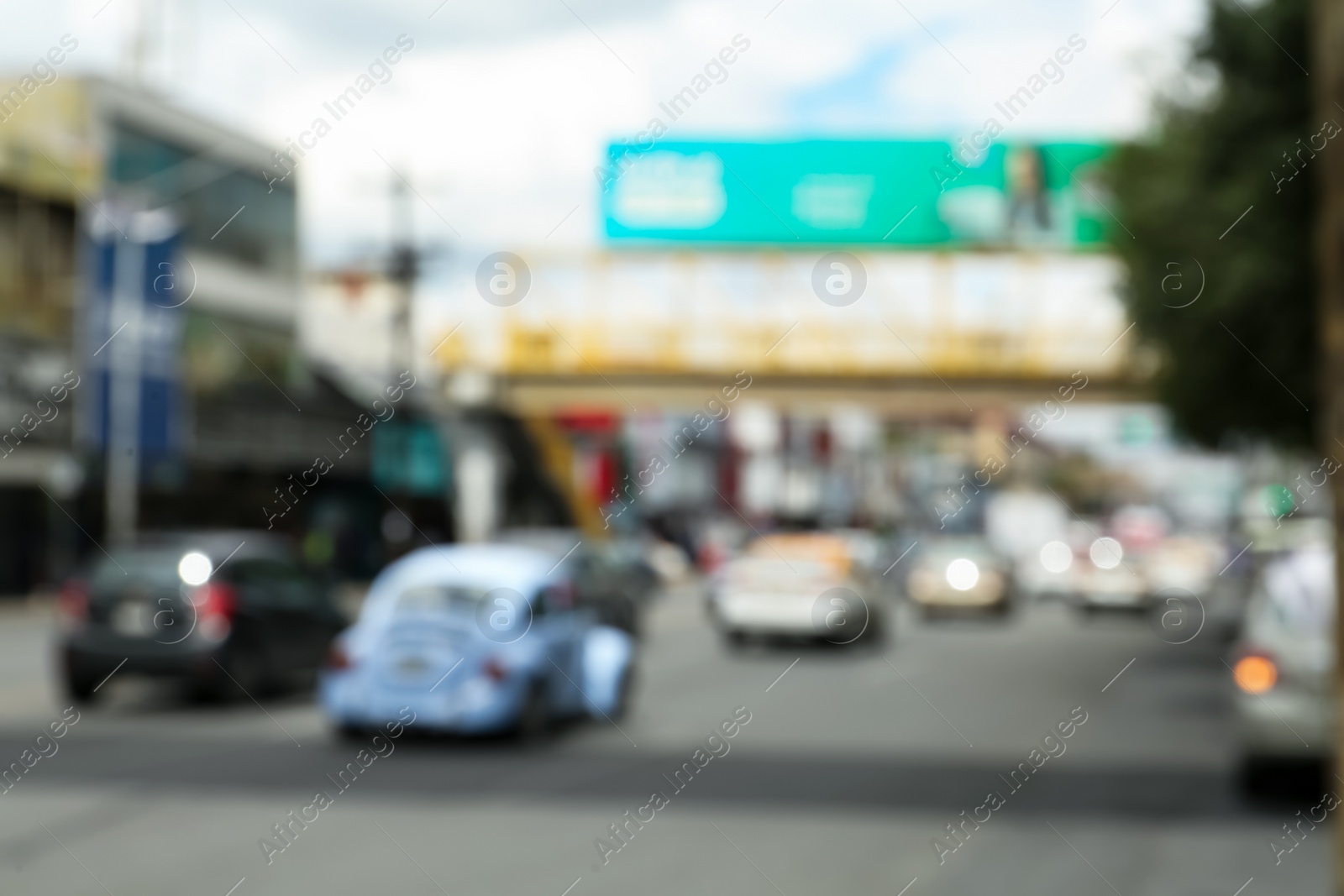 Photo of Blurred view of cars on road in city. Bokeh effect