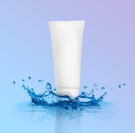 Tube of cosmetic products and splashing water on color gradient background. Space for design