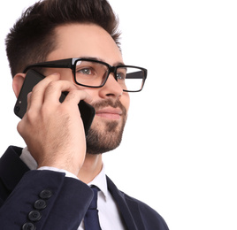 Photo of Young businessman talking on smartphone against white background