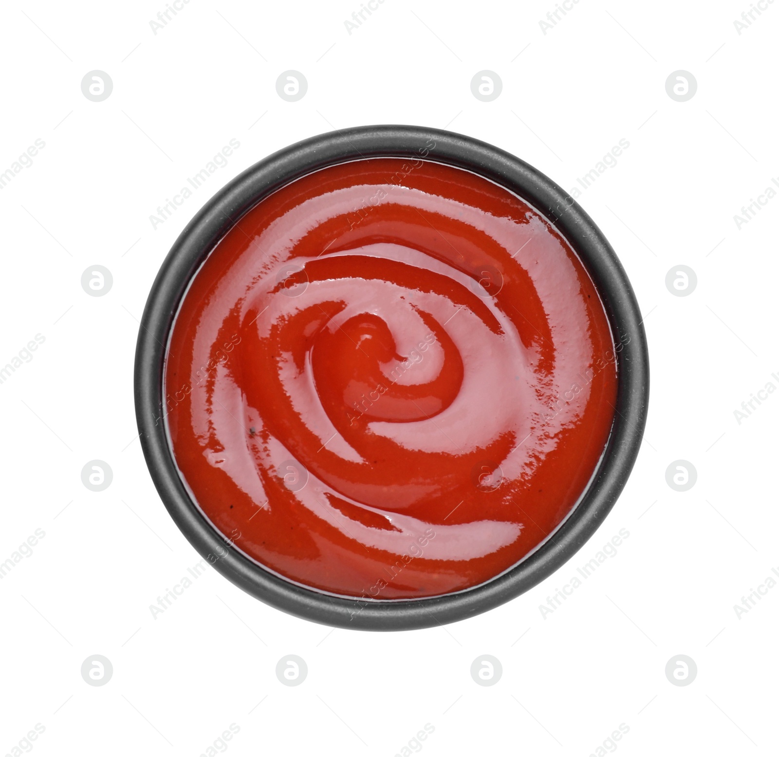 Bowl of tasty ketchup isolated on white, top view. Tomato sauce Photo of Bowl of tasty ketchup isolated on white, top view. Tomato sauce