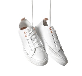 Photo of Pair of casual shoes on white background