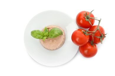 Photo of Plate of delicious meat pate with basil leaves and cherry tomatoes on white background, top view