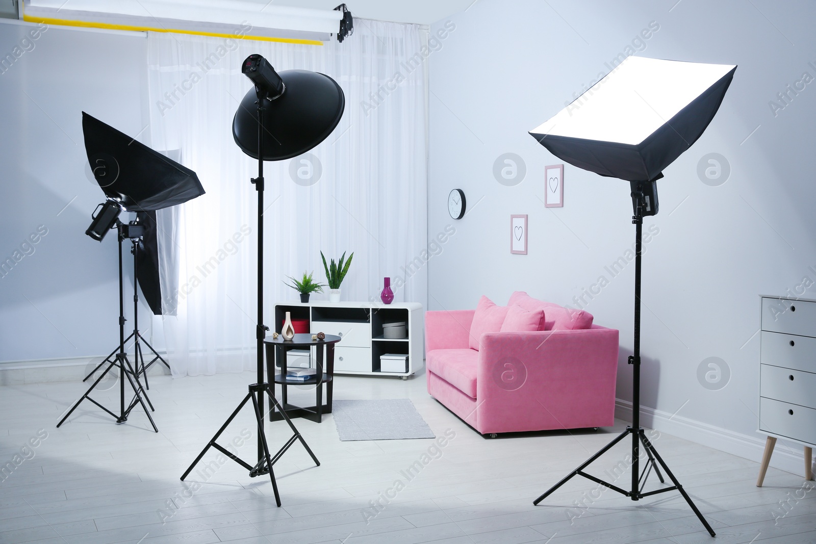 Photo of Example of living room interior design and professional equipment in photo studio