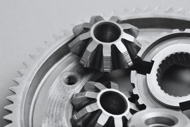 Photo of Different stainless steel gears on light grey background, top view