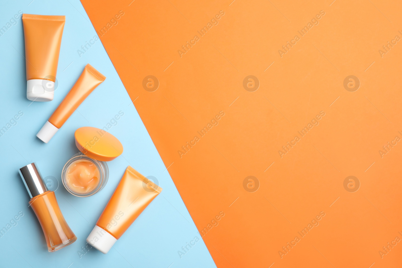 Photo of Set of luxury cosmetic products on color background, flat lay. Space for text