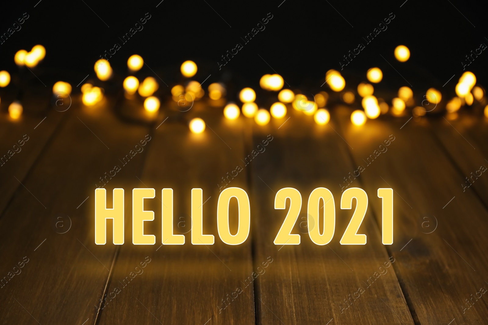 Image of Hello 2021. Wooden surface and beautiful lights, bokeh effect