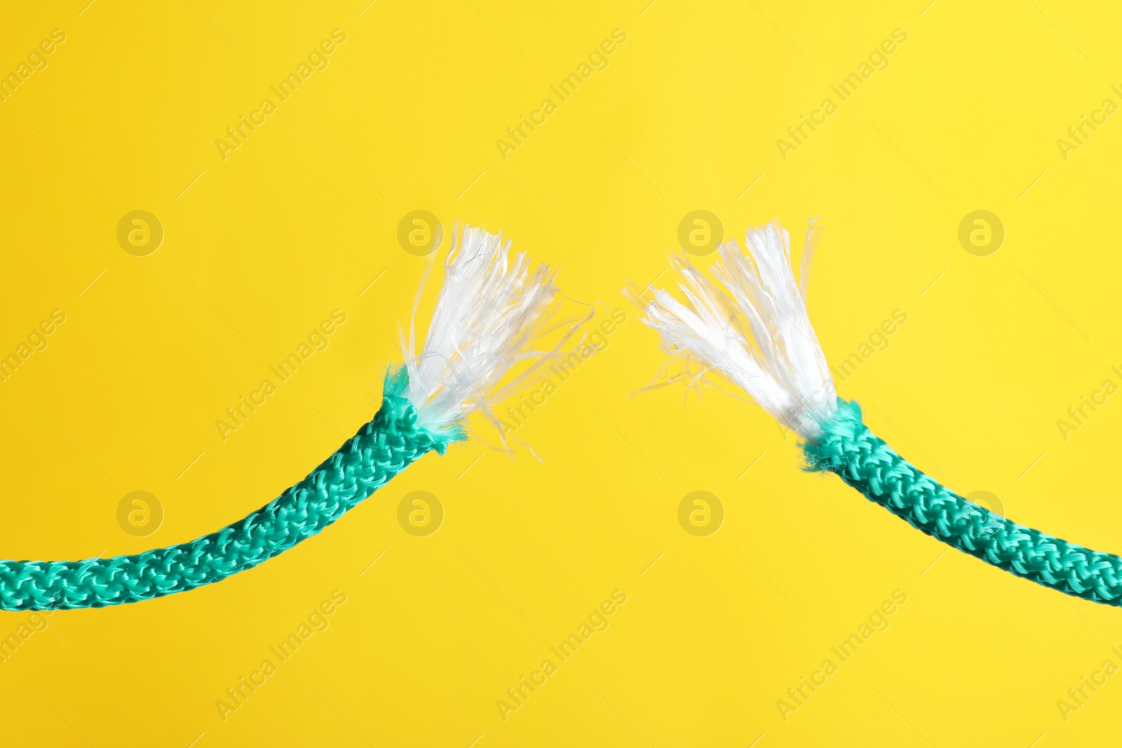 Photo of Rupture of blue rope on color background