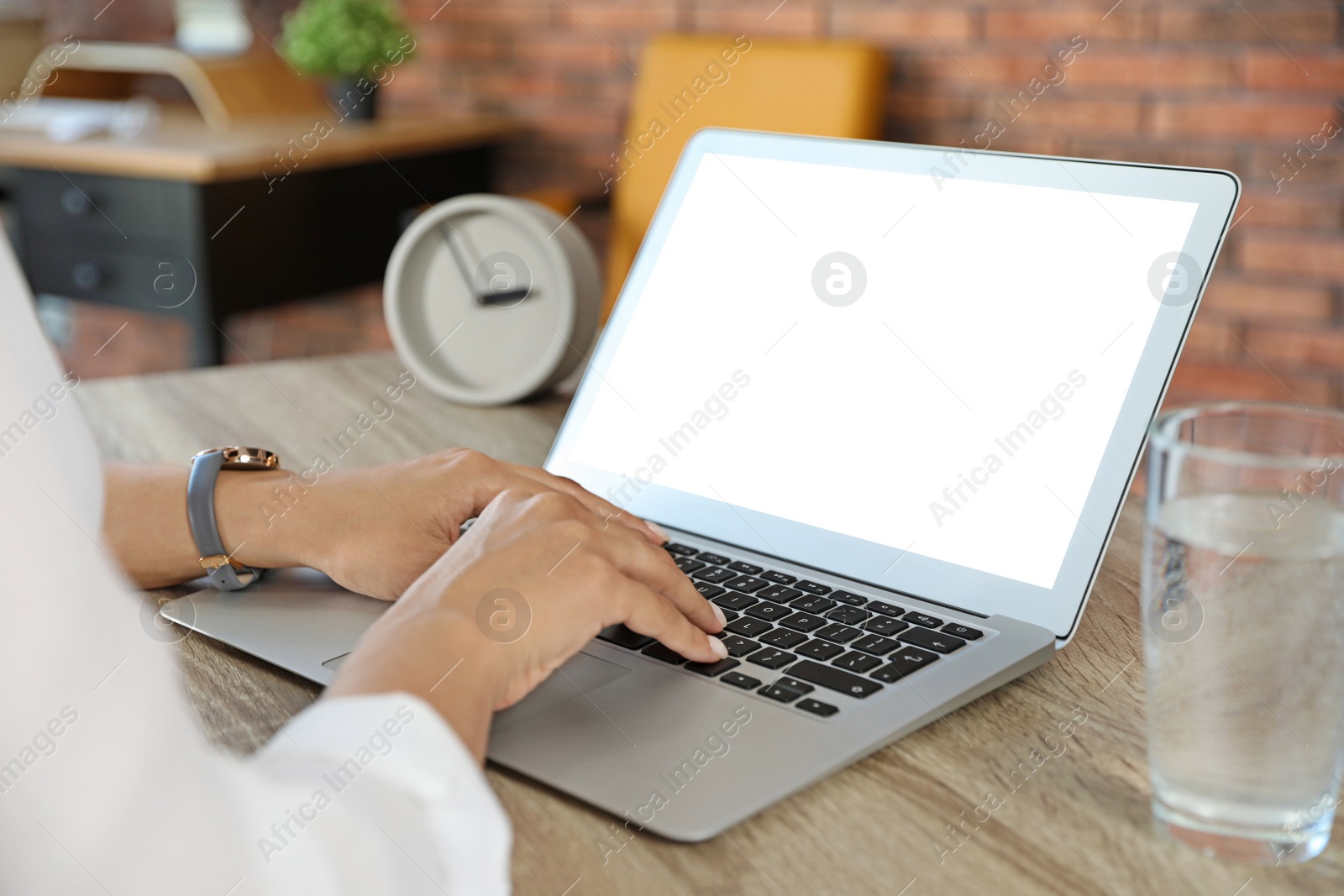 Image of Young woman using modern computer at table indoors, closeup. Space for design