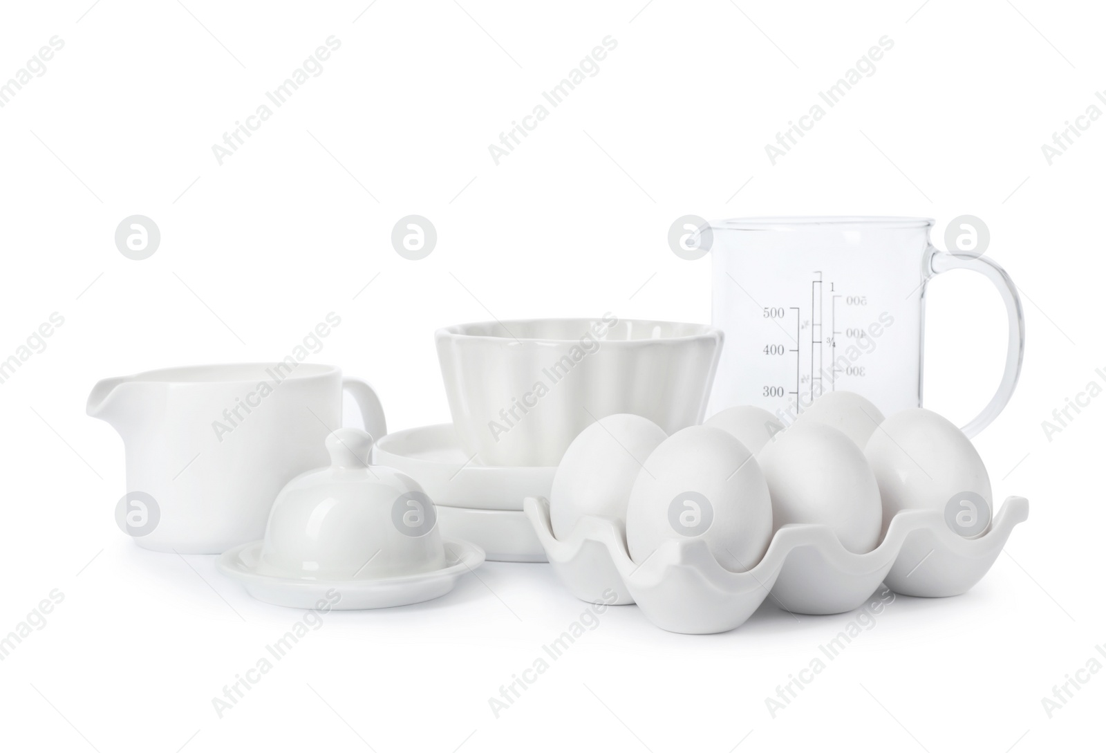 Photo of Set of clean tableware and chicken eggs on white background. Washing dishes