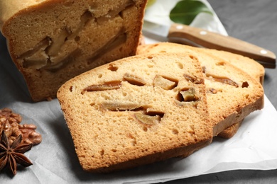 Photo of Slices of tasty pear bread on table, closeup. Homemade cake