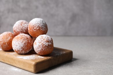 Photo of Delicious sweet buns on gray table, space for text