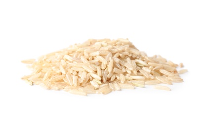 Pile of uncooked brown rice on white background