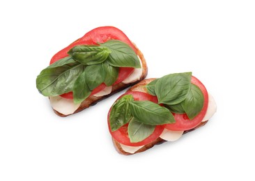 Delicious Caprese sandwiches with mozzarella, tomatoes and basil isolated on white, top view
