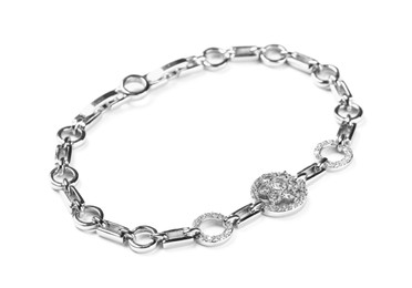 Photo of Elegant silver bracelet with gemstones isolated on white. Luxury jewelry