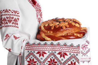 Photo of Woman with korovai on white background, closeup. Ukrainian bread and salt welcoming tradition