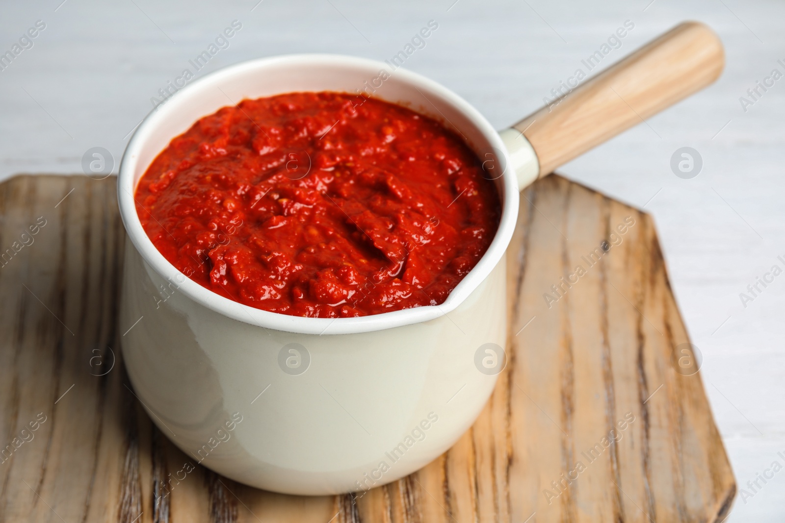 Photo of Delicious tomato sauce in pan, closeup view