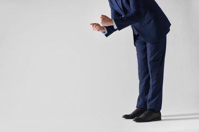 Photo of Businessman with angry fists on white background, closeup