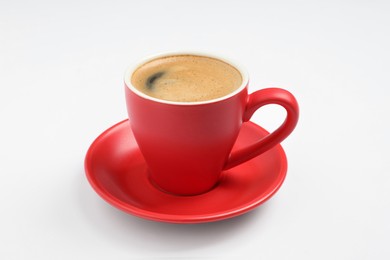 Aromatic coffee in red cup on white background