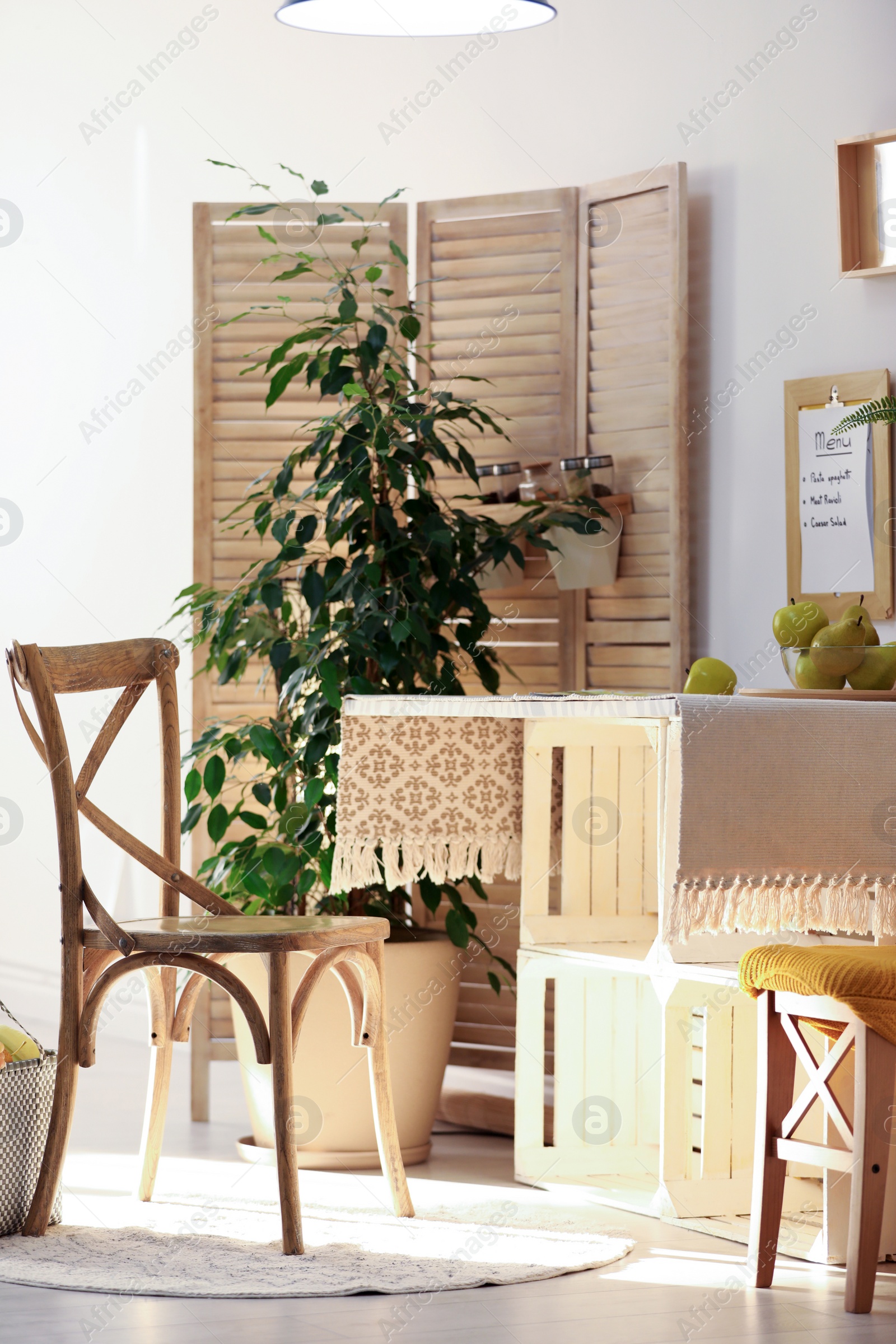 Photo of Modern kitchen interior with wooden crates as eco furniture