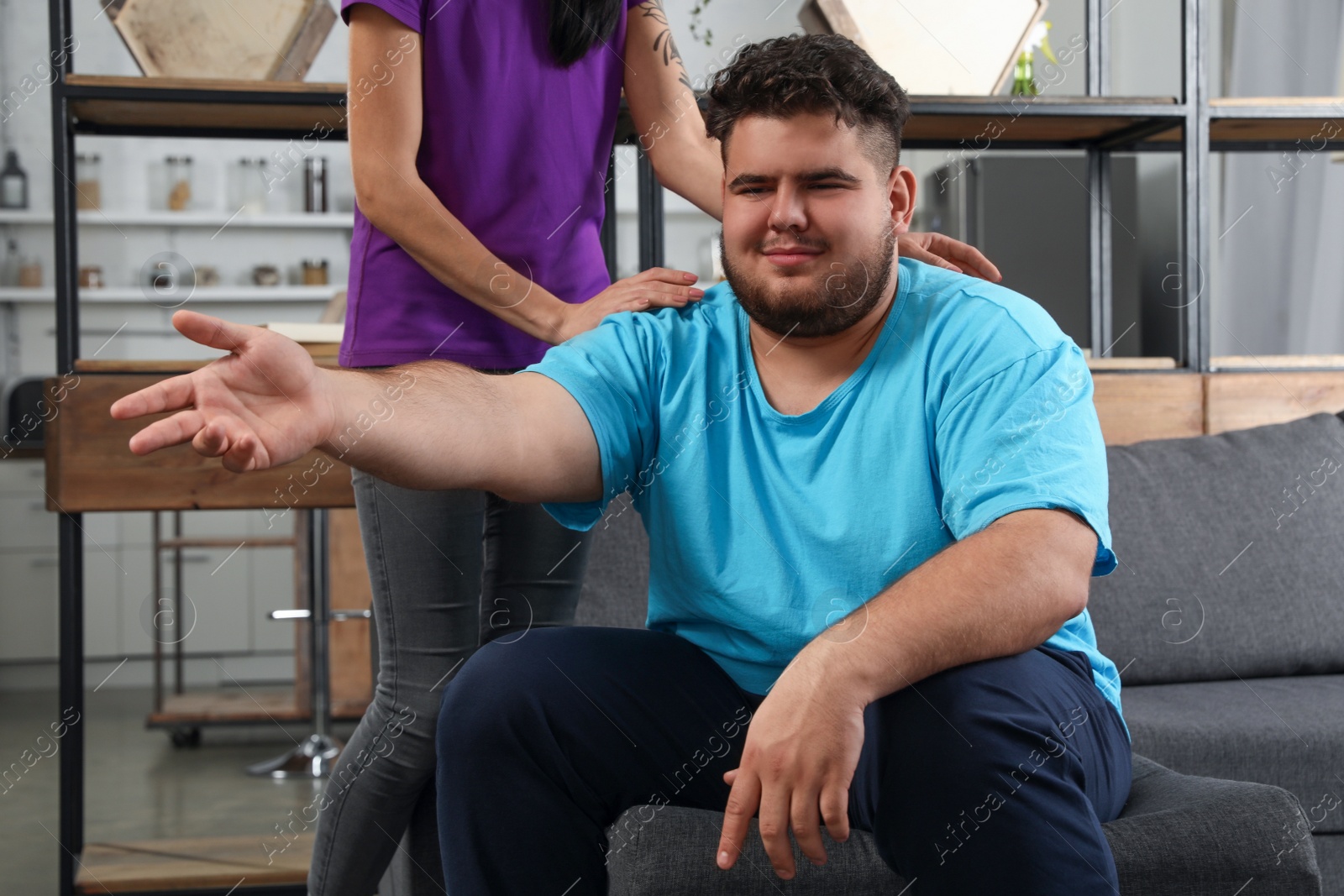 Photo of Woman comforting her depressed overweight friend at home