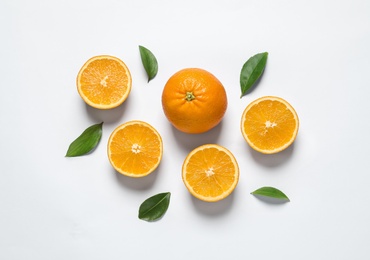 Composition with ripe oranges on white background, top view