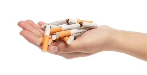 Stop smoking. Man holding broken cigarettes on white background, closeup