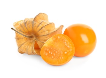 Cut and whole physalis fruits with dry husk on white background
