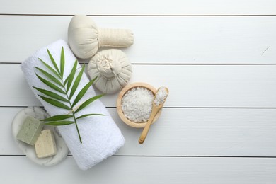 Photo of Flat lay composition with different spa products on white wooden table. Space for text