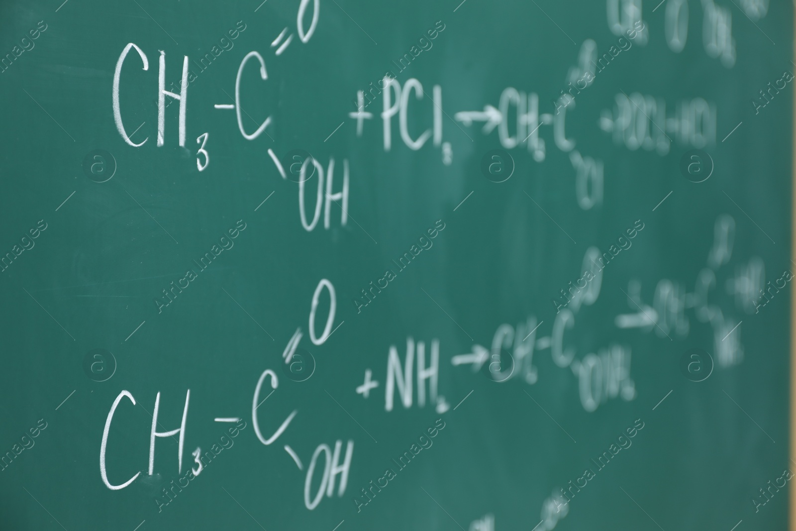 Photo of Chemical formulas written with chalk on green board